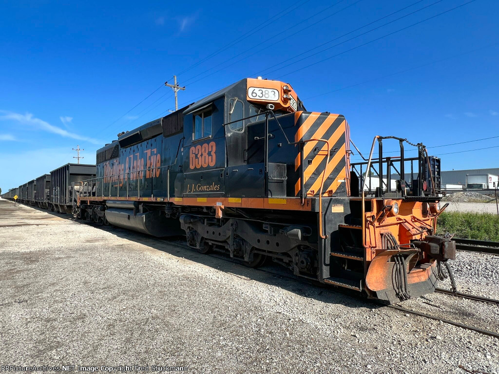 WE 6383 has brought the empties and placed them in the siding.